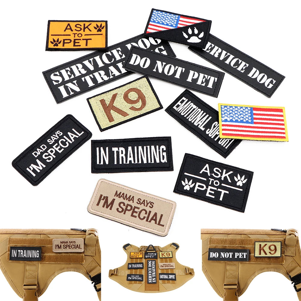 Collection of dog patches with various messages on a white background.